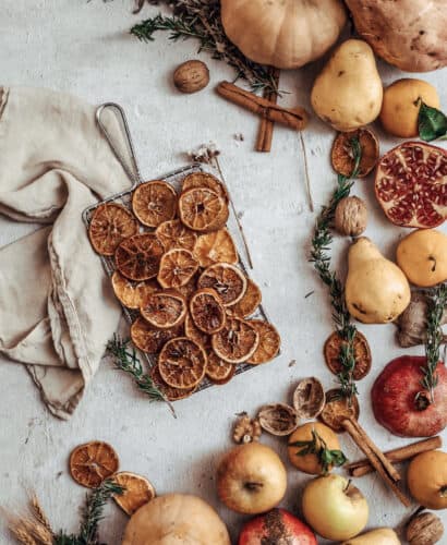 cover image of oven dried orange slices with fall produce