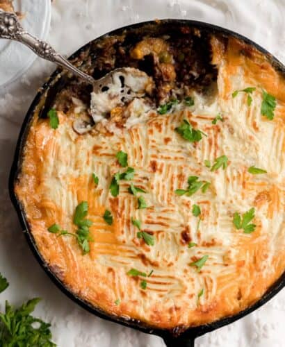 overhead image of spoon scooping out cottage pie