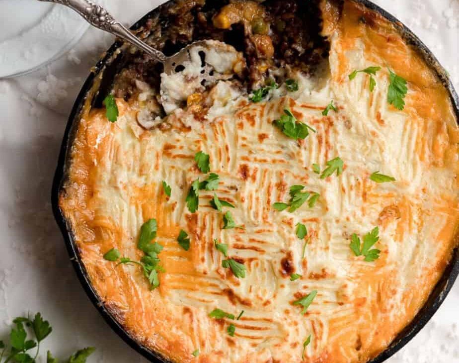 overhead image of spoon scooping out cottage pie
