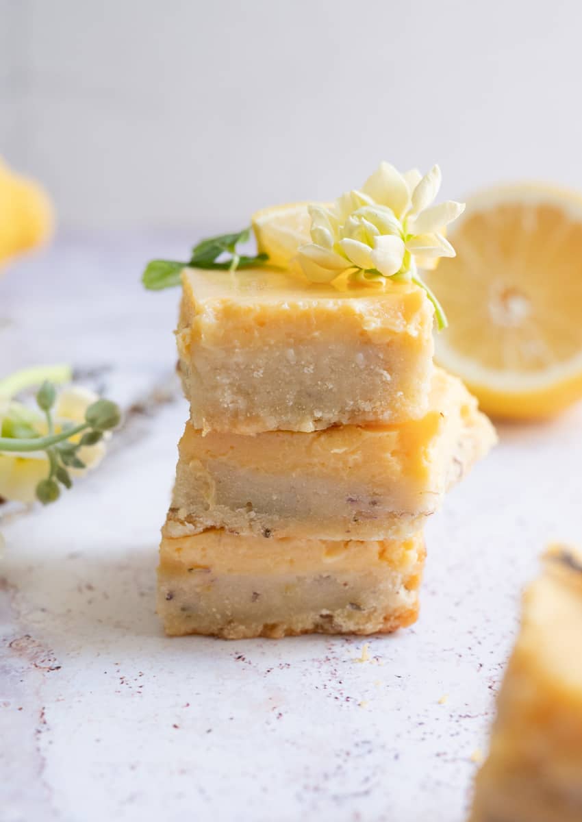 straight shot of 3 lavender lemon shortbread cookie bars stacked on top of each other