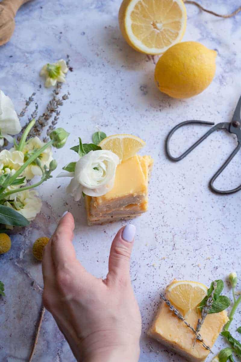 hand grabbing for lemon lavender shortbread bar