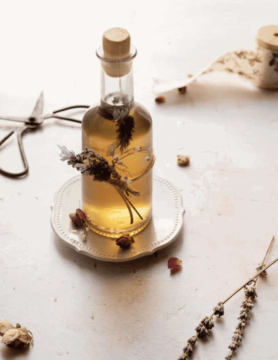 close up shot of lavender simple syrup with lavender tied to it