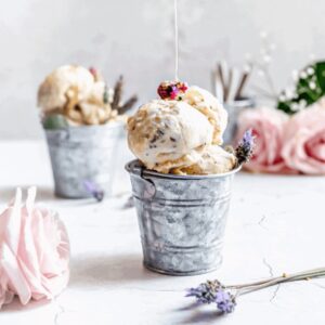 cover image 1200x1200 close up shot of galvanized tin bucket with scoops of lavender honey ice cream