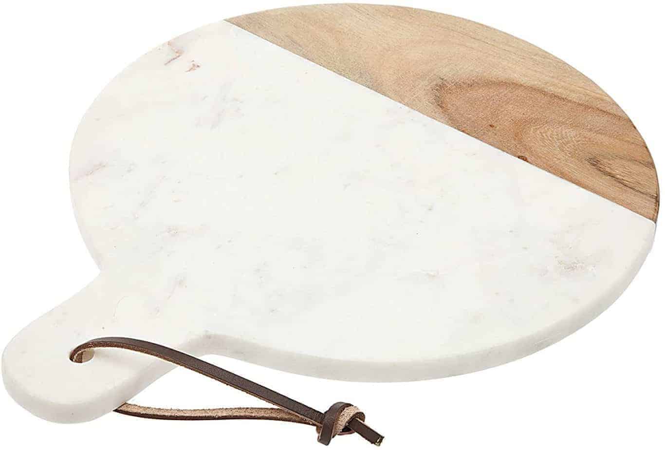 amazon image of marble charcuterie slab, circle, with leather twine and wood
