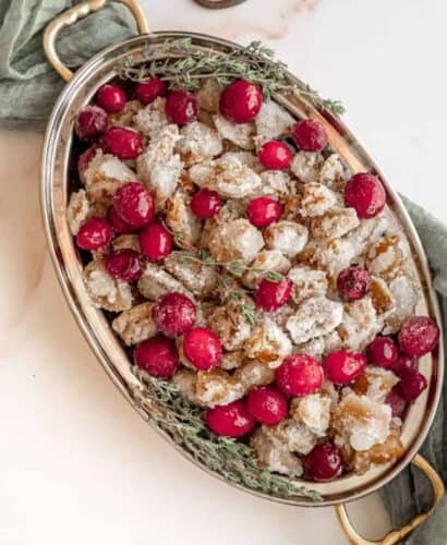 overhead image of oval dish with candied ginger and candied cranberries