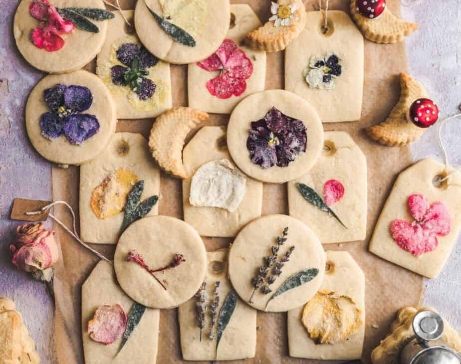 overhead shot of cookies decorated with edible flowers