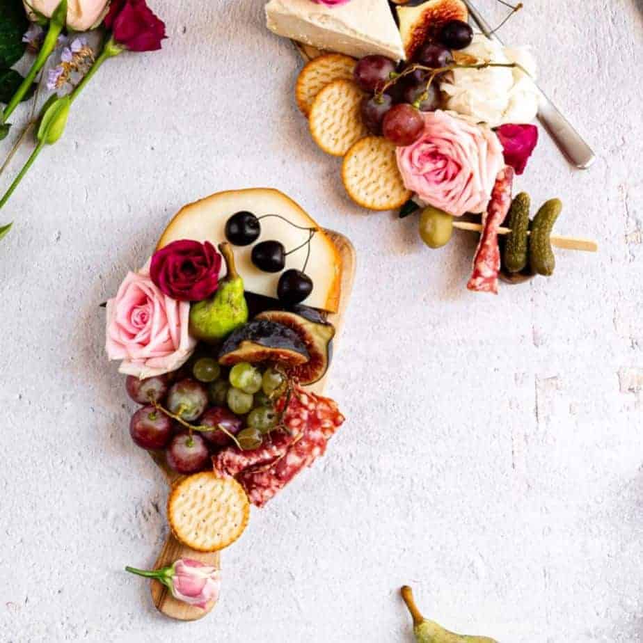 overhead shot of small charcuterie boards beautifully styled with meat and cheese