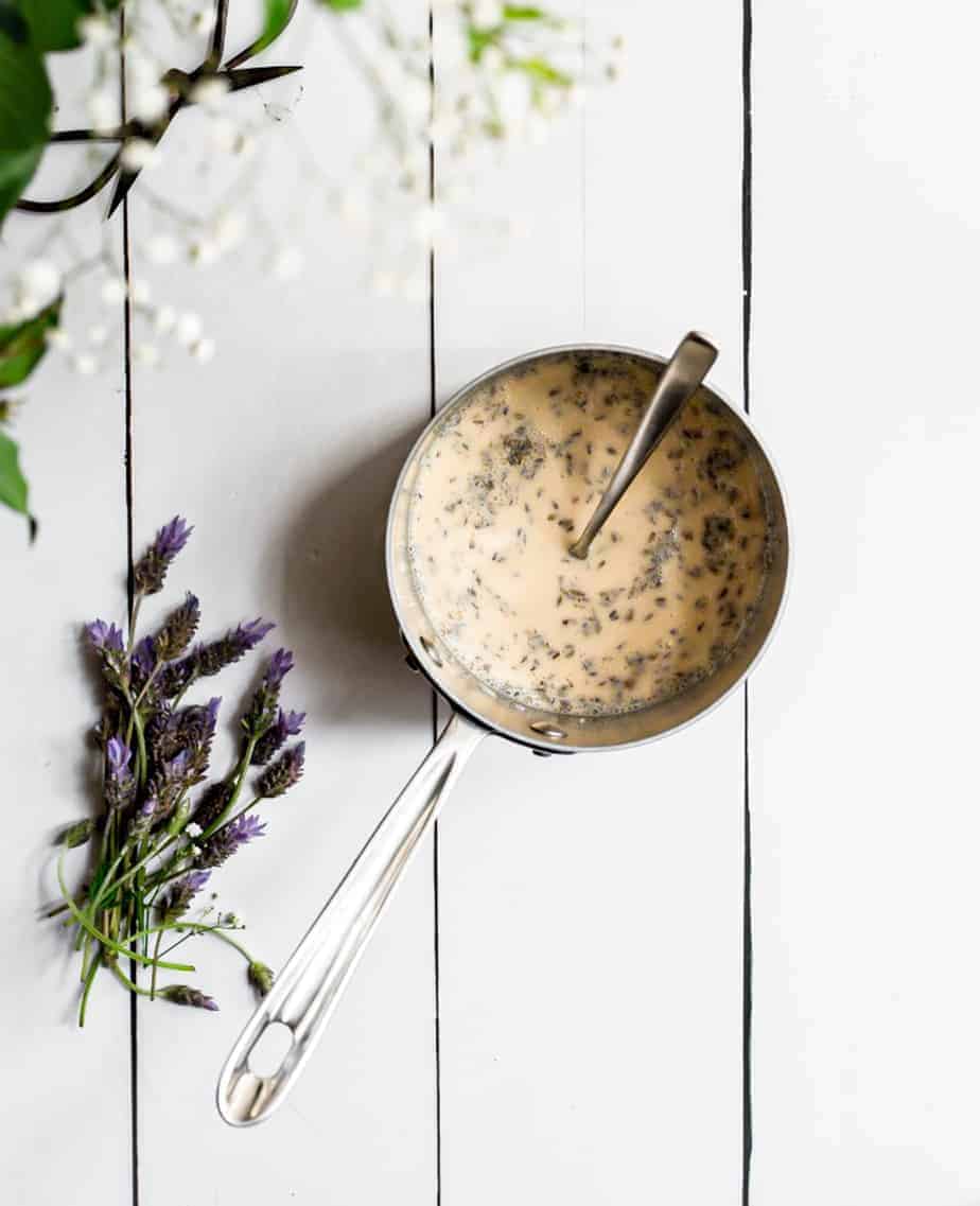 process shot of lavender honey ice cream being made in a small sauce pan