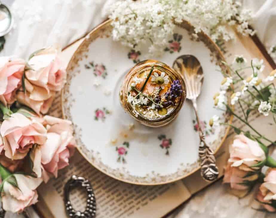 overhead shot looking into a jar of floral infused honey