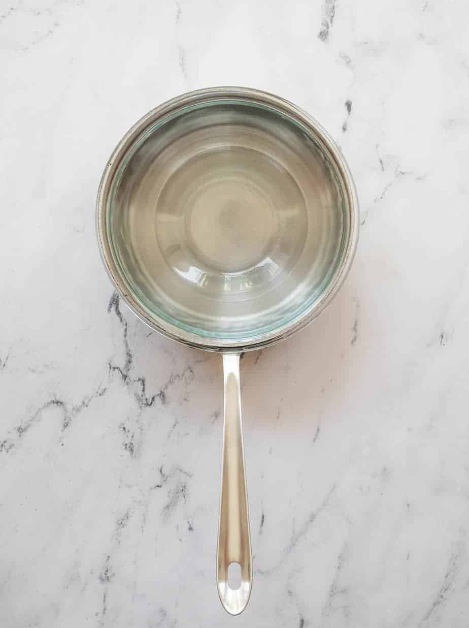 homemade double boiler with small sauce pan with large glass bowl on top