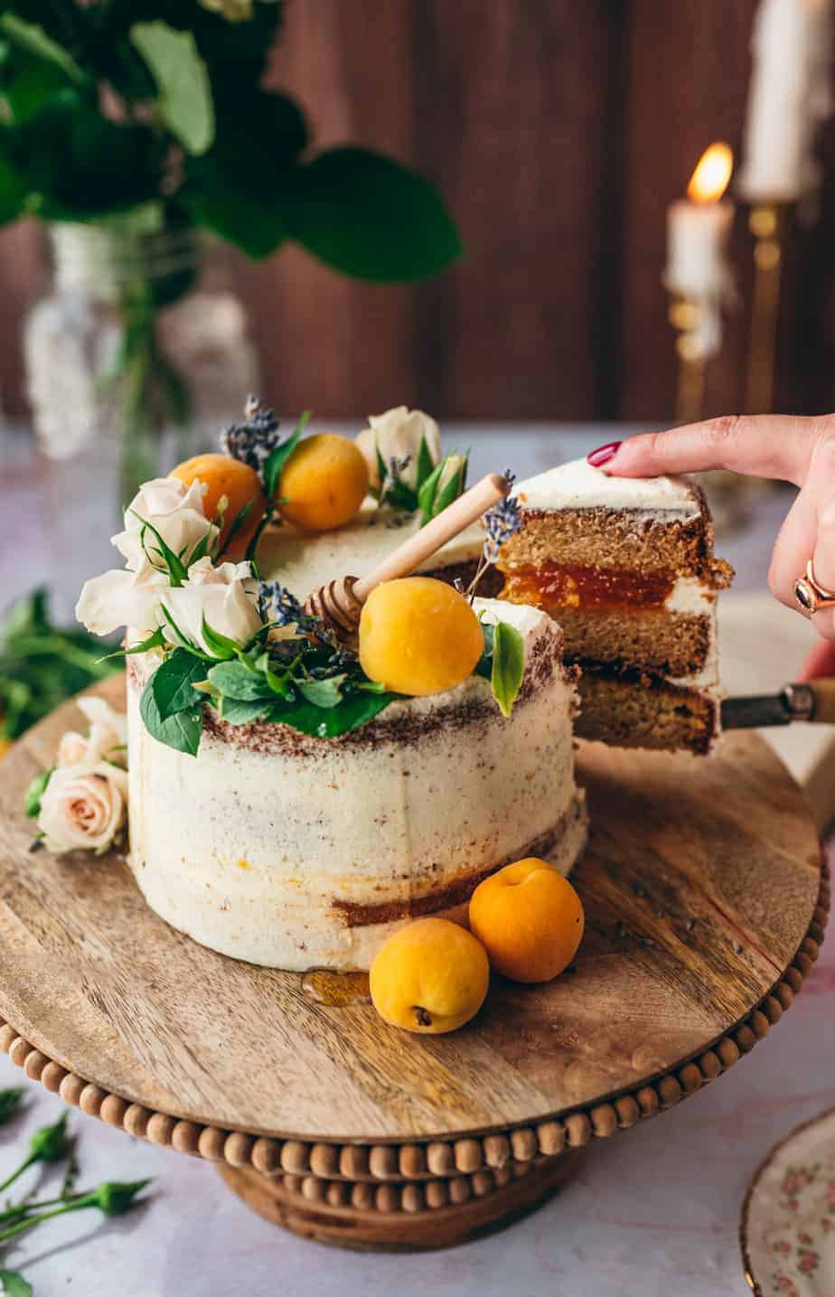 woman's hand cutting a slice of cake