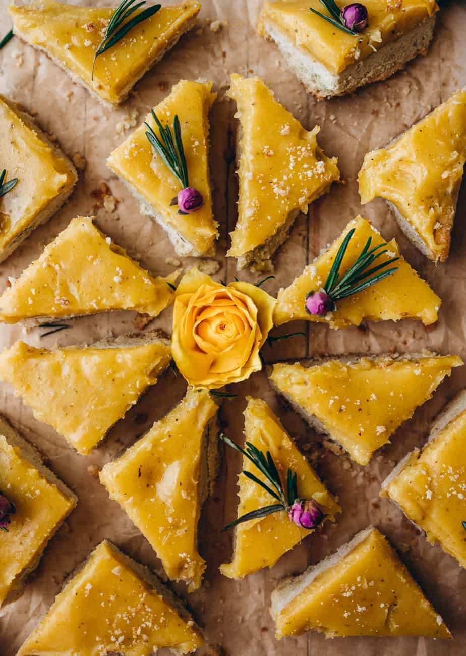 beautiful arrangement of sliced lemon rosemary bars in pattern garnished with pink and yellow roses