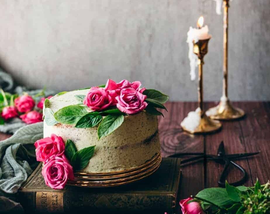 photo of cake with bright green mint basil buttercream with pink roses