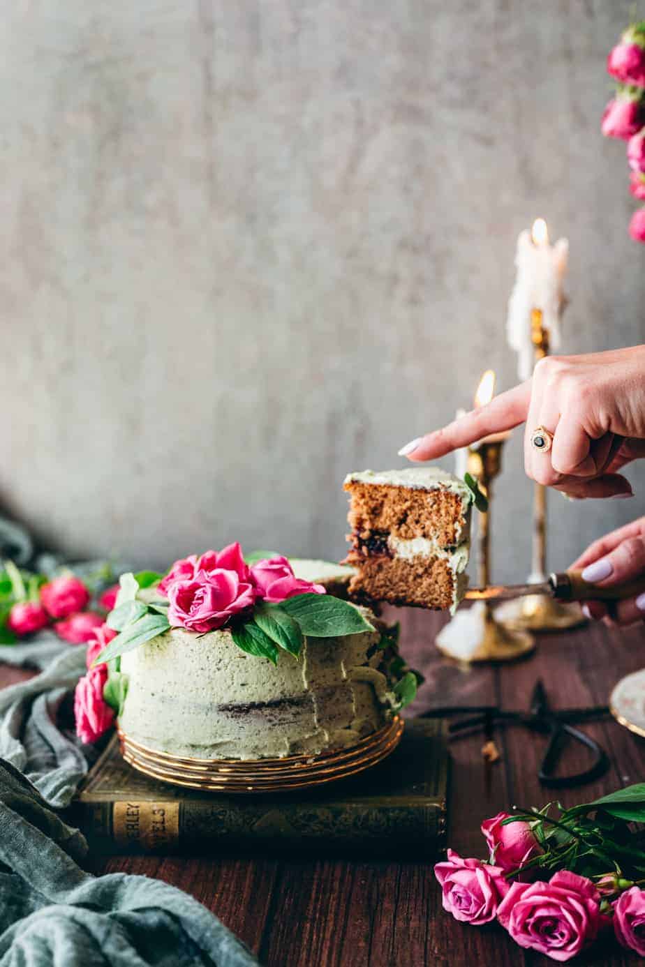 woman's hand serving a slice of mint basil cake