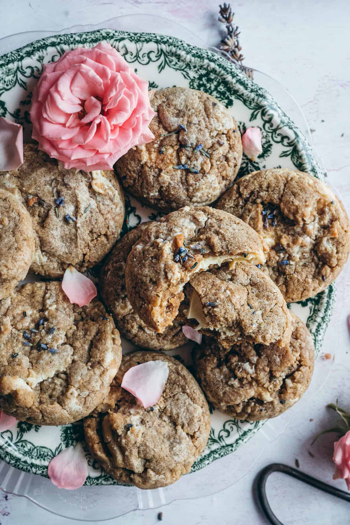 close up shot of soft baked cookie with white chocolate and lavender buds