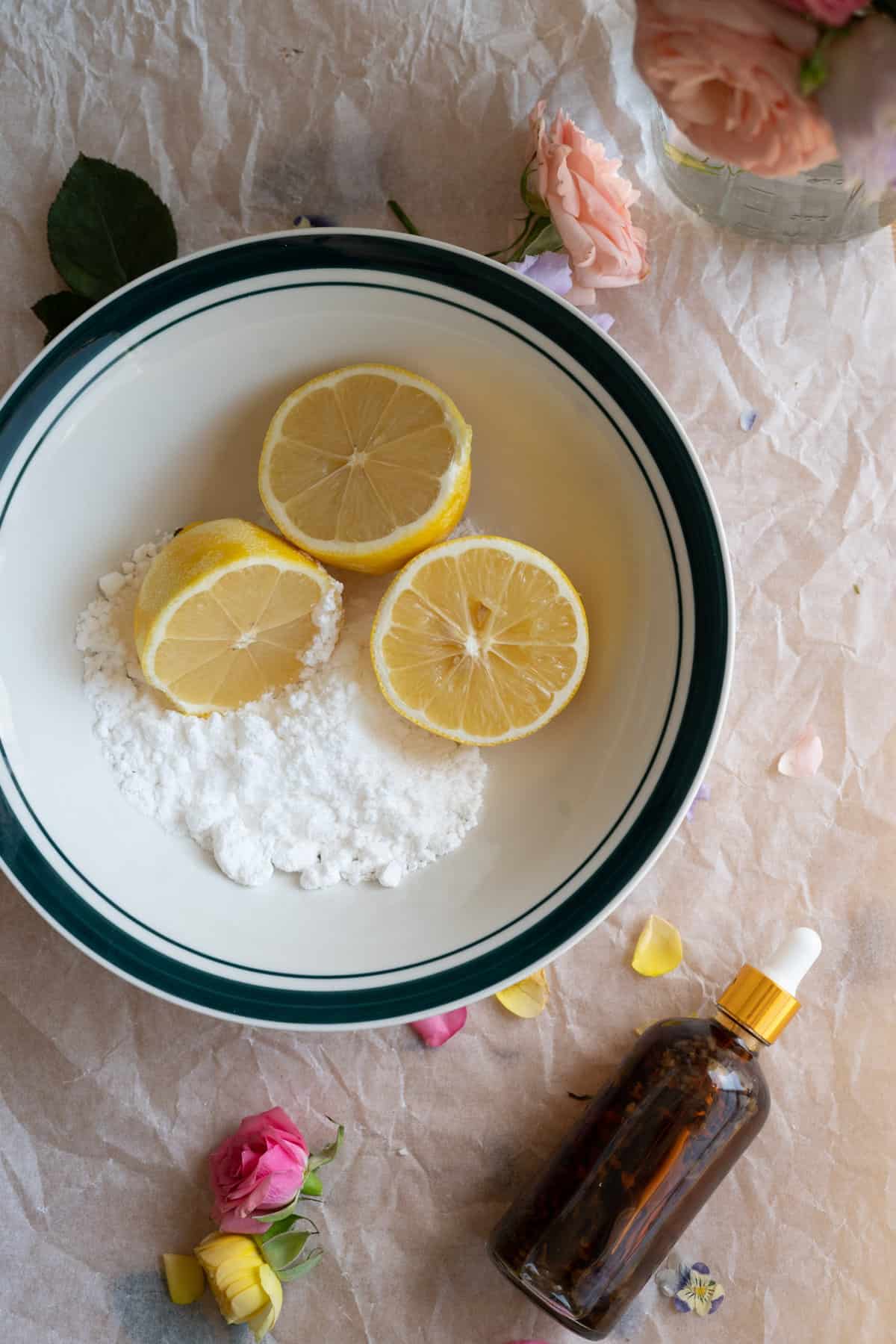 overhead shot of ingredient for lemon icing, sliced lemons and icing sugar