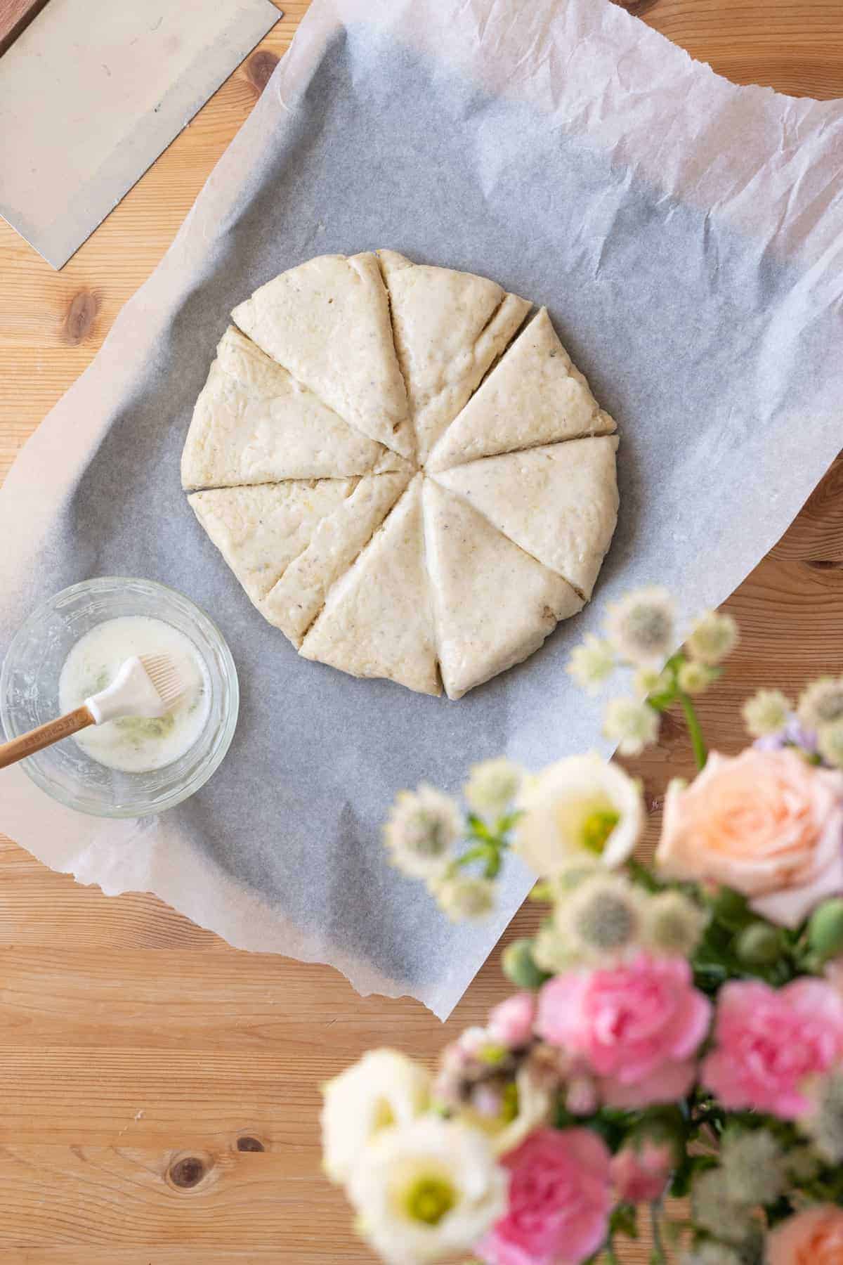 Scones arranged on parchment paper