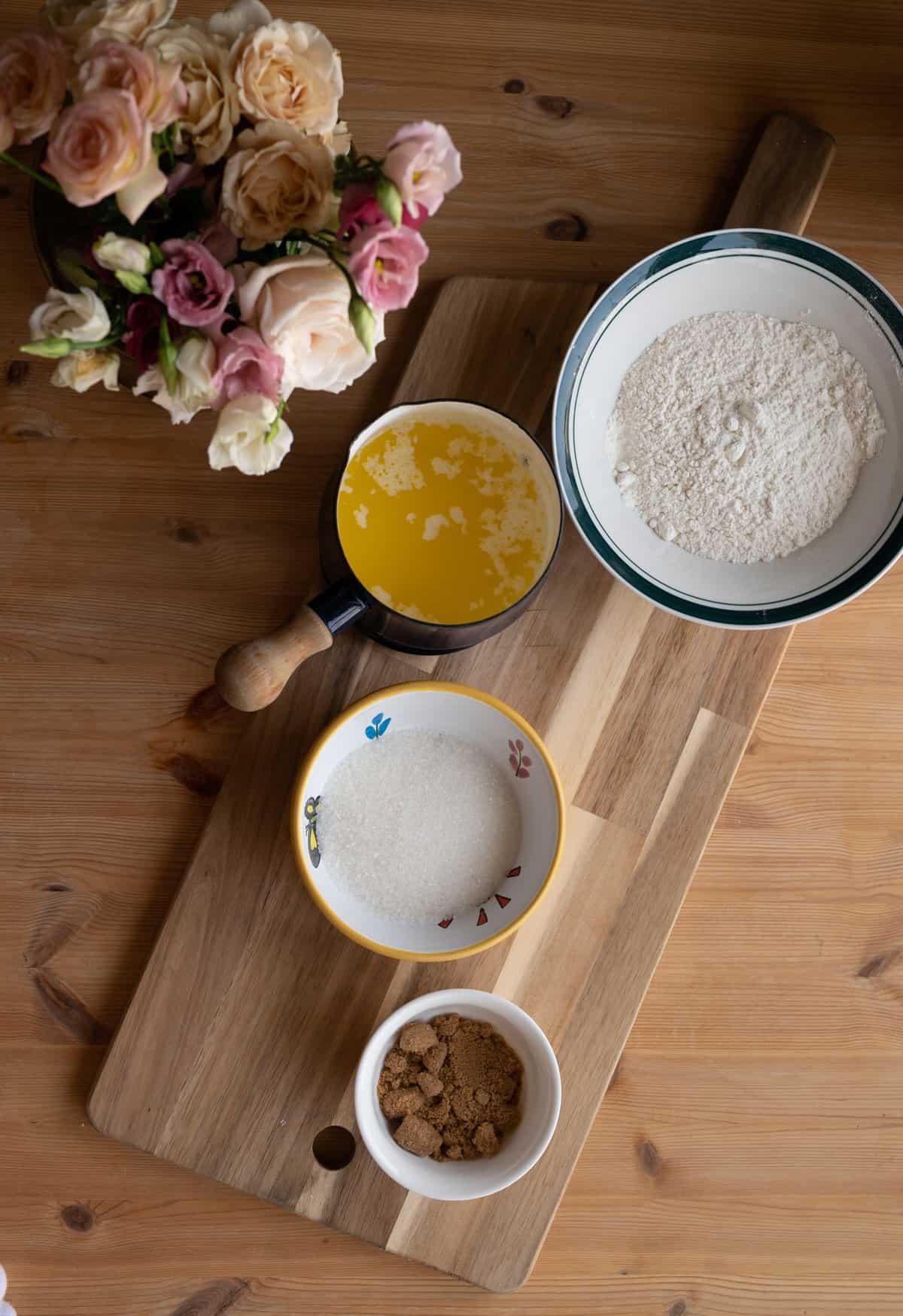 ingredients of crumble topping in bowls and dishes